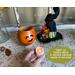 This is a Halloween witch made from a dried gourd. Its witch hat sits next to it. A battery-operated candle is included with your purchase.